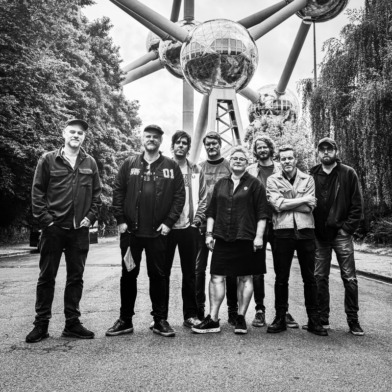 Photo of the band members of Jaga Jazzist standing in front of an art installation