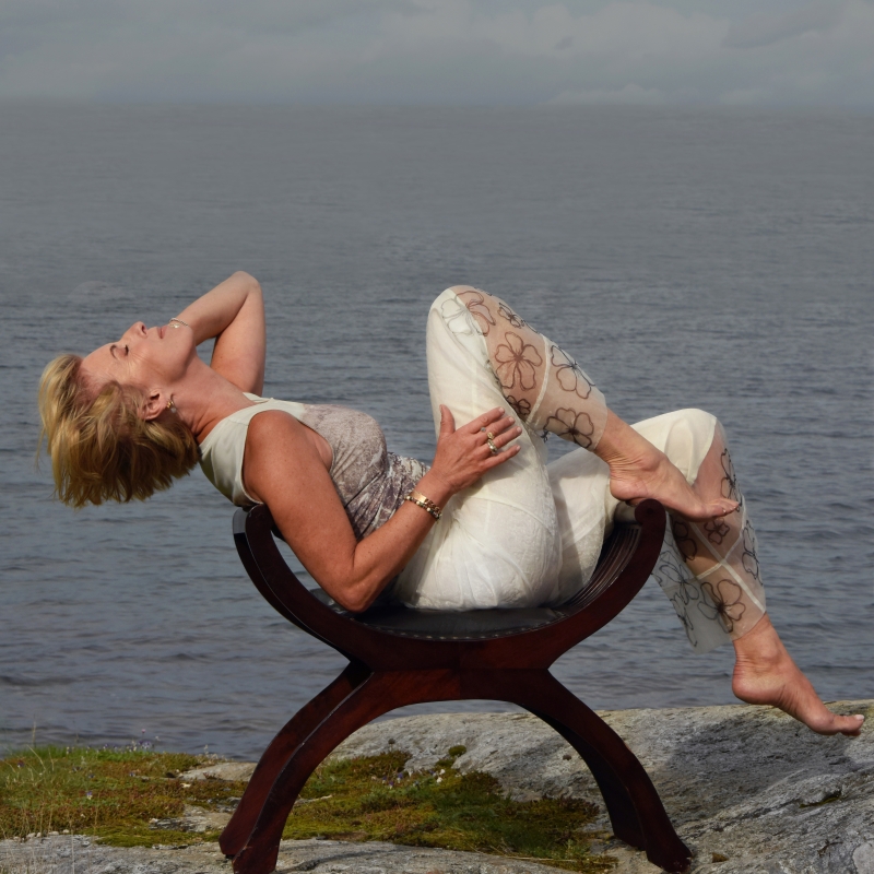 Photo of Silje Nergaard on a chair in front of the Oslo fjord