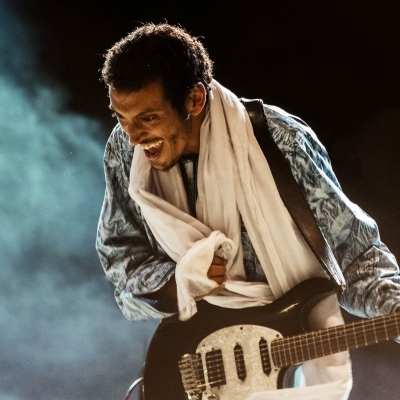 Photo of Bombino with his guitar